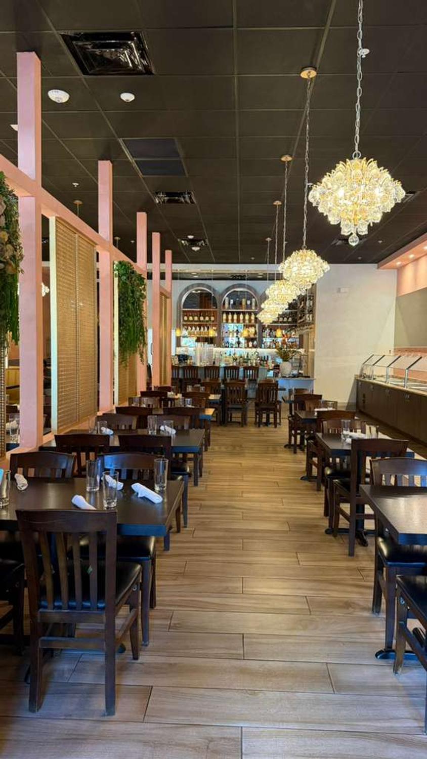 Bombay Grove main dining room with chandeliers in Boca Raton