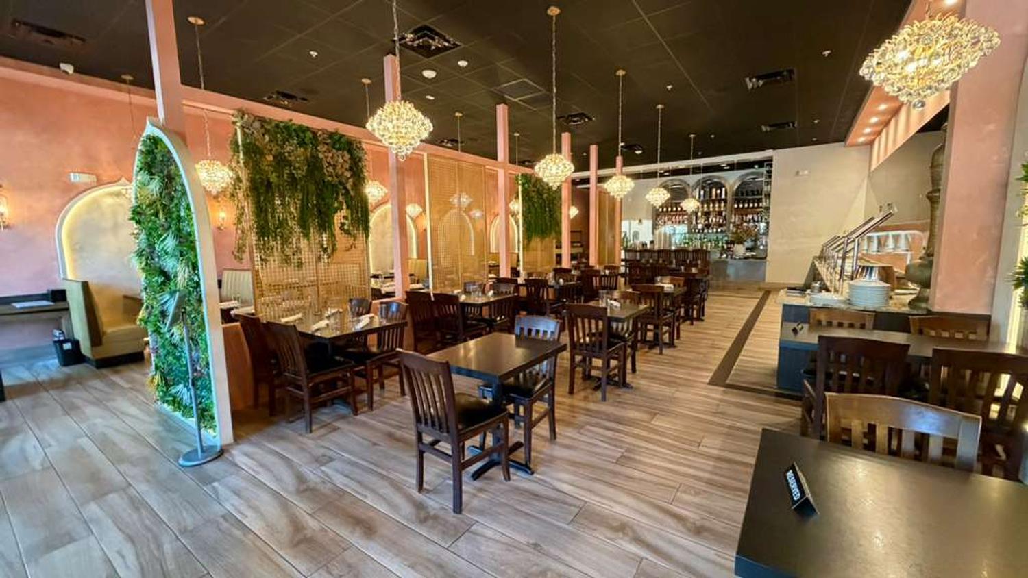 Dining room ambience with chandeliers and living greenery