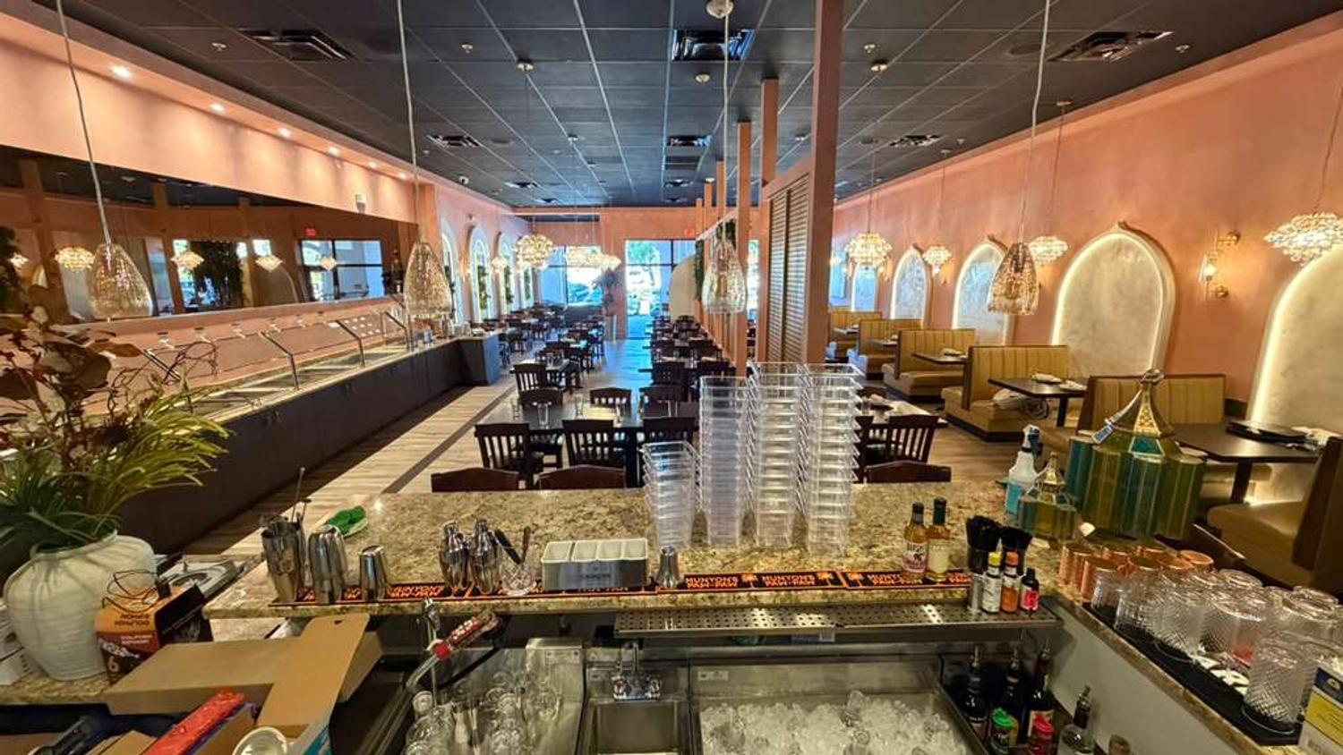 Buffet service line and dining room at Bombay Grove